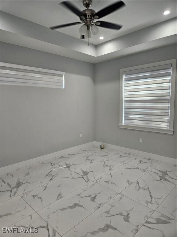 empty room with ceiling fan, baseboards, and recessed lighting