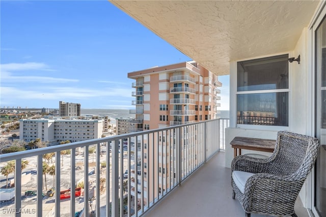 balcony featuring a water view