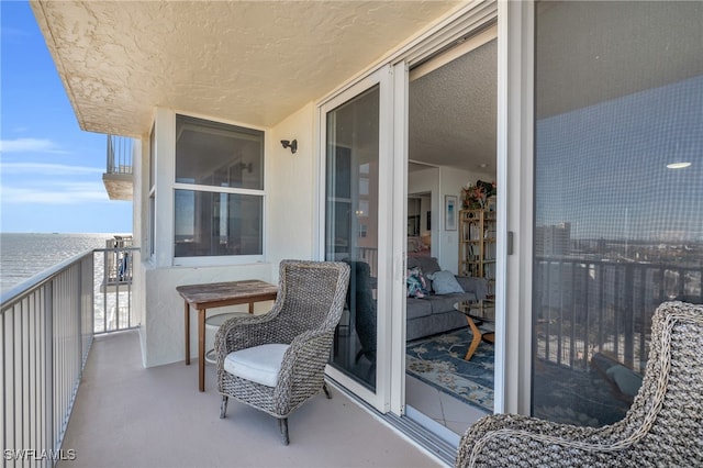 balcony featuring a water view