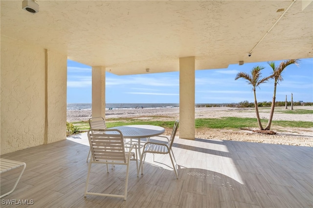 view of patio featuring a water view