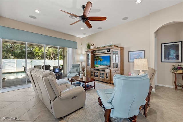 tiled living room featuring ceiling fan