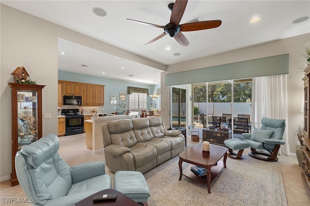 tiled living room with ceiling fan