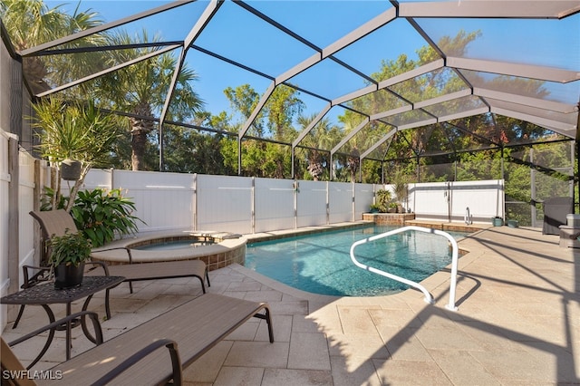 view of swimming pool with a patio area, an in ground hot tub, and glass enclosure