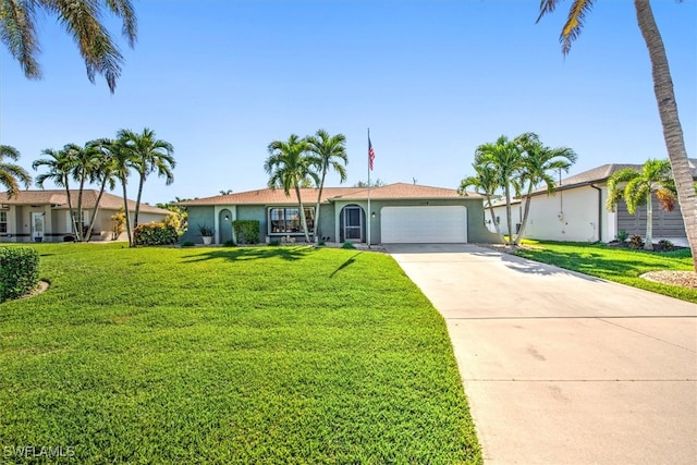 ranch-style house featuring a garage and a front lawn