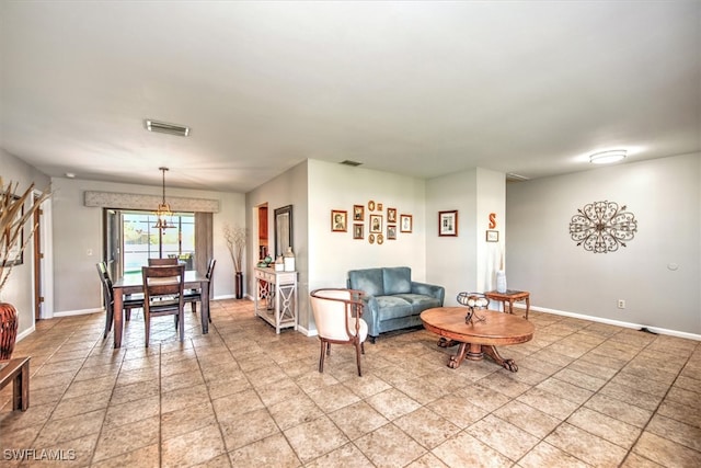 living room featuring a chandelier