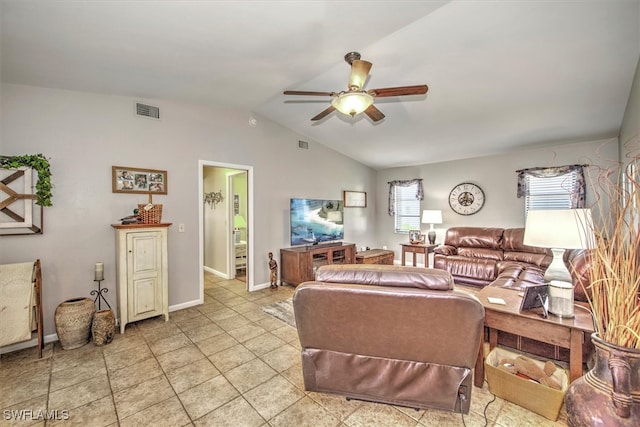 living room featuring ceiling fan and lofted ceiling