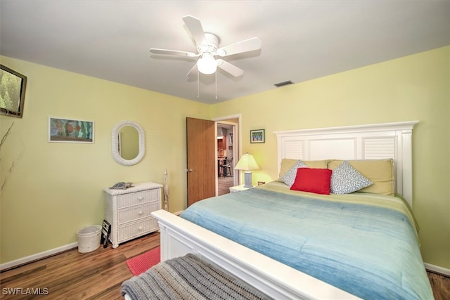 bedroom featuring dark hardwood / wood-style flooring and ceiling fan