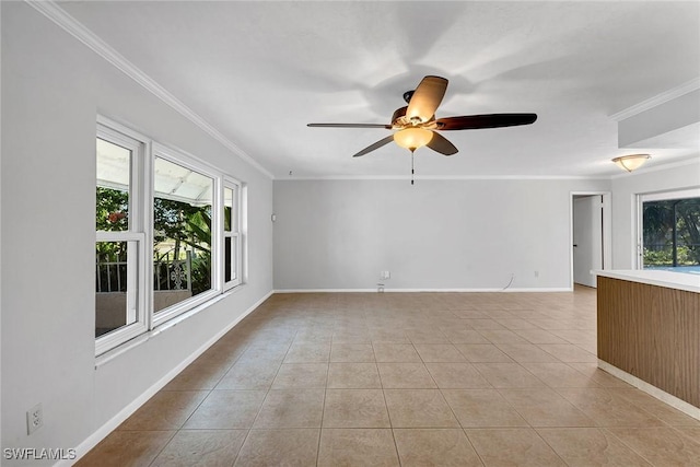 tiled spare room with ceiling fan and ornamental molding