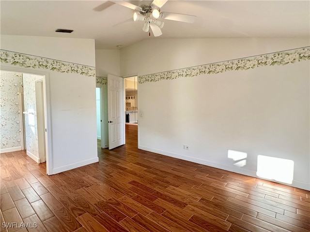 unfurnished bedroom featuring vaulted ceiling, ceiling fan, and dark hardwood / wood-style floors