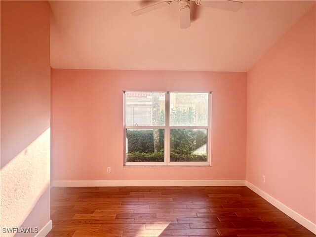 empty room with hardwood / wood-style floors, ceiling fan, and lofted ceiling