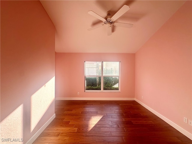 spare room featuring ceiling fan, wood-type flooring, and lofted ceiling