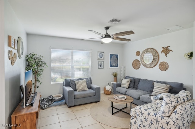 tiled living room featuring ceiling fan