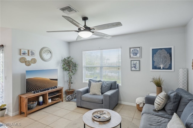 living room featuring light tile patterned floors and ceiling fan