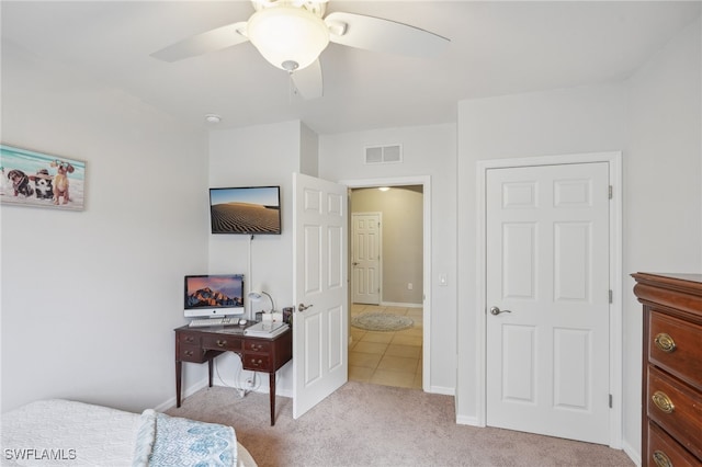 bedroom featuring ceiling fan and light carpet