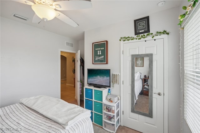 bedroom featuring ceiling fan and carpet floors