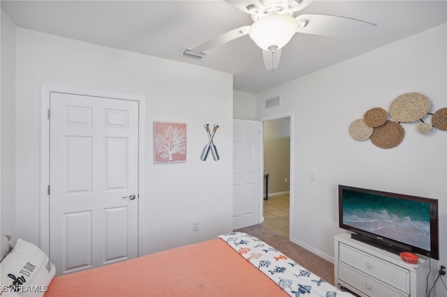 carpeted bedroom with ceiling fan