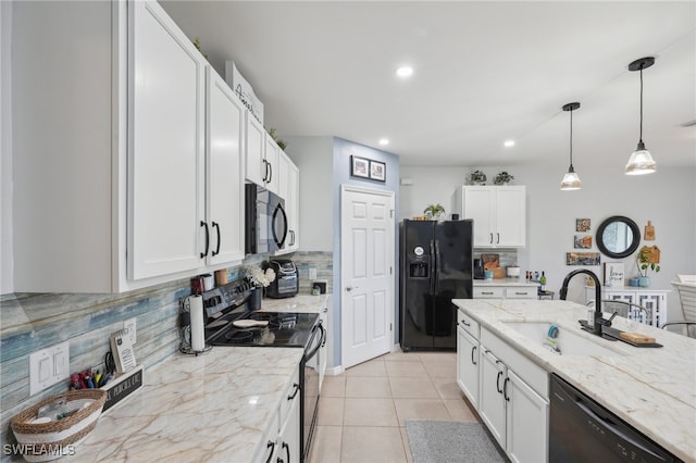 kitchen with white cabinetry, sink, tasteful backsplash, decorative light fixtures, and black appliances