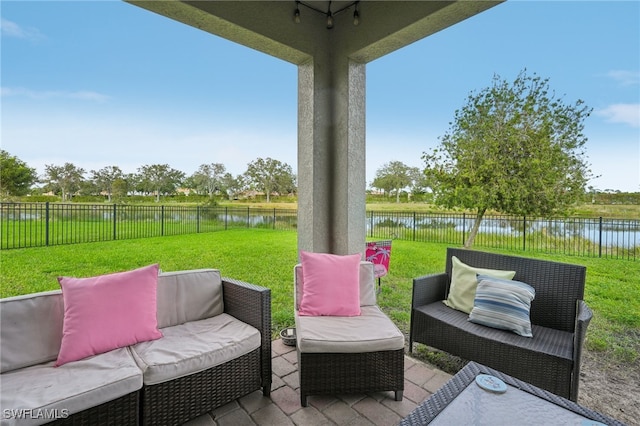 view of patio / terrace featuring an outdoor living space and a water view