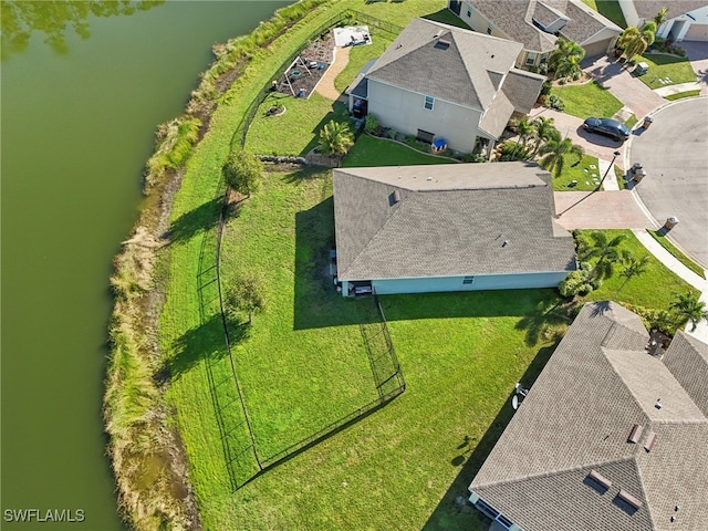 birds eye view of property with a water view