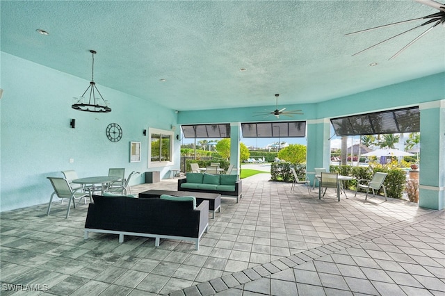 view of patio with ceiling fan and an outdoor hangout area