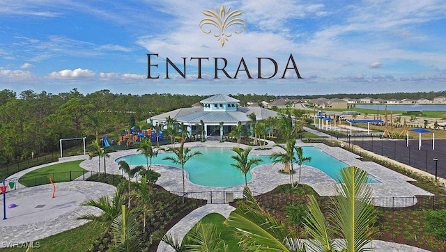 view of swimming pool featuring a water view