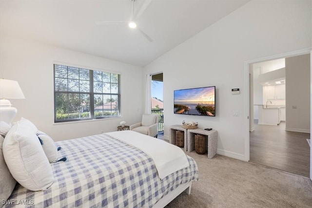 carpeted bedroom featuring ceiling fan and lofted ceiling