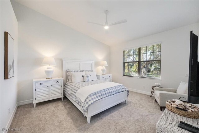 carpeted bedroom with ceiling fan and lofted ceiling