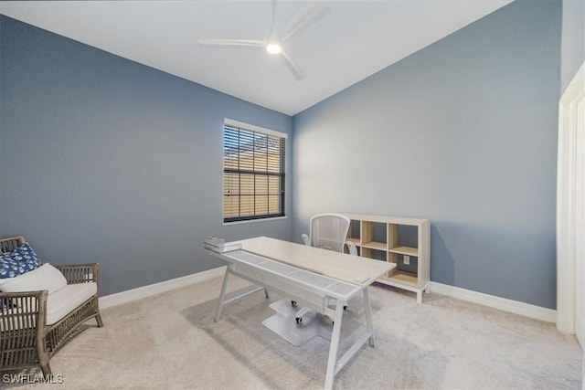 office space featuring light carpet and vaulted ceiling