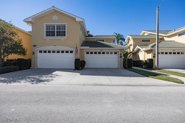 front of property with a garage