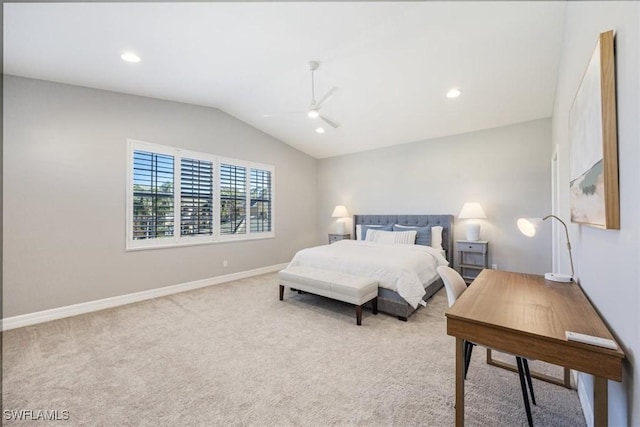 bedroom featuring light carpet, vaulted ceiling, and ceiling fan