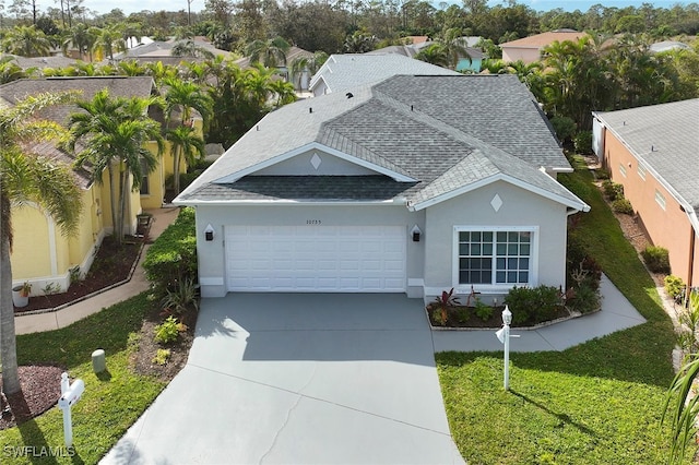 view of front of home with a garage and a front yard