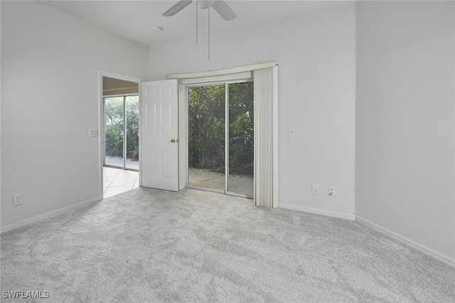 unfurnished room featuring light carpet and ceiling fan