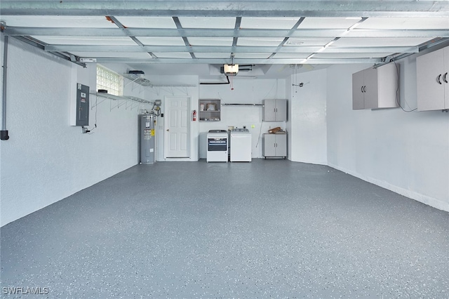 garage featuring independent washer and dryer, electric panel, a garage door opener, and water heater