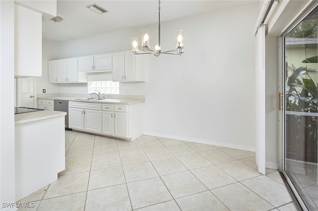 kitchen featuring white cabinets, a notable chandelier, pendant lighting, and stainless steel dishwasher