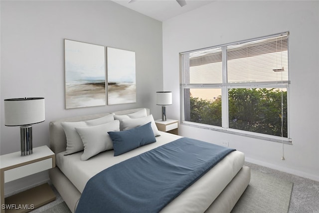 carpeted bedroom with ceiling fan