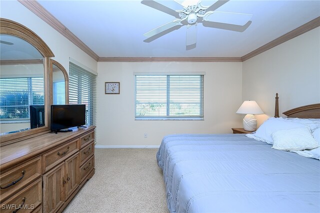 bedroom with multiple windows, ceiling fan, light colored carpet, and ornamental molding