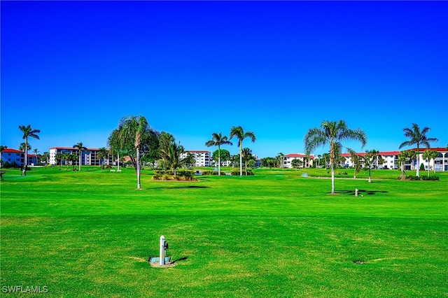 view of property's community featuring a lawn