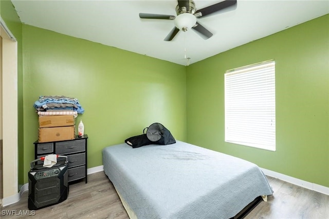 bedroom featuring light hardwood / wood-style flooring and ceiling fan