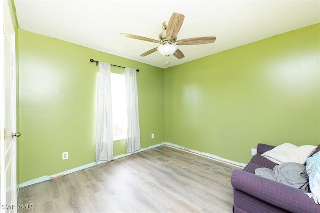 unfurnished room featuring ceiling fan and light hardwood / wood-style floors