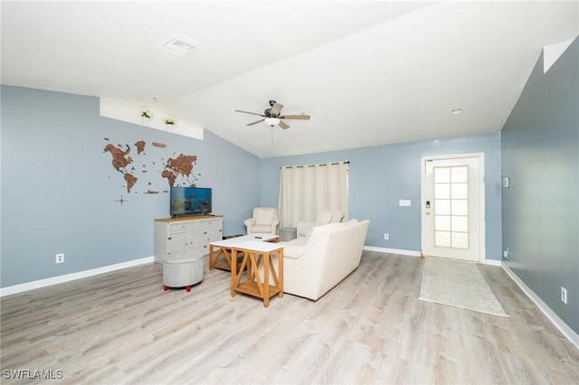 living room featuring light wood-type flooring, ceiling fan, and lofted ceiling