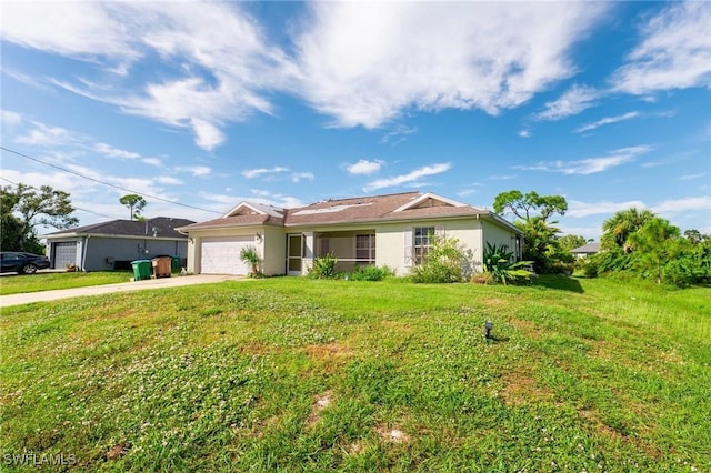 single story home featuring a front lawn and a garage