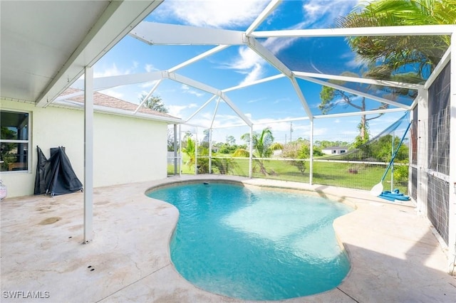 view of pool featuring a lanai and a patio