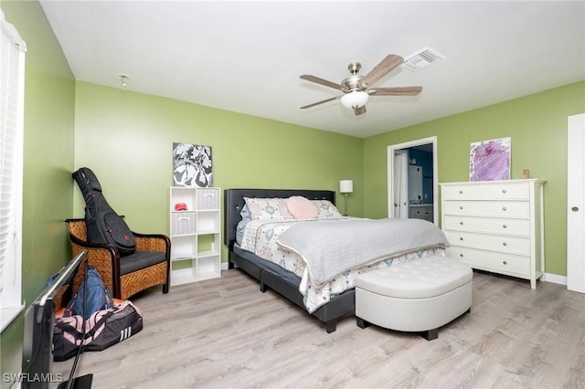 bedroom with light hardwood / wood-style floors and ceiling fan