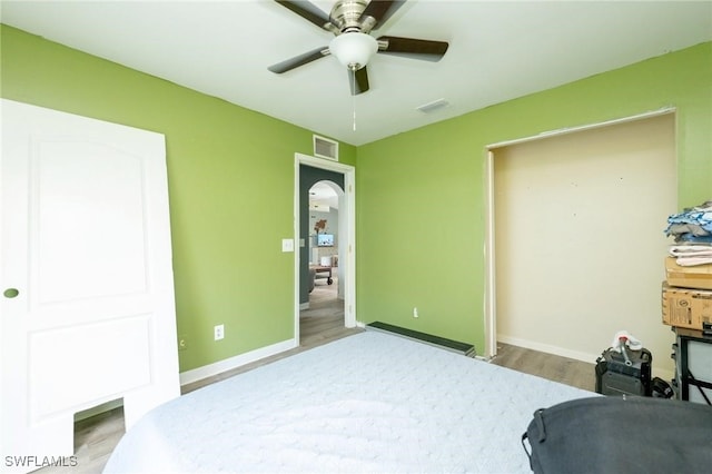 bedroom featuring ceiling fan and wood-type flooring