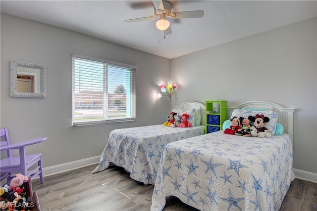 bedroom featuring ceiling fan and wood-type flooring