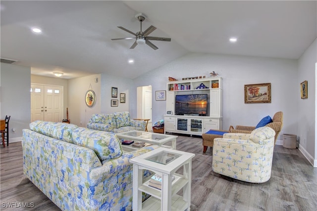 living room with hardwood / wood-style floors, ceiling fan, and lofted ceiling