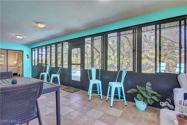 sunroom with plenty of natural light