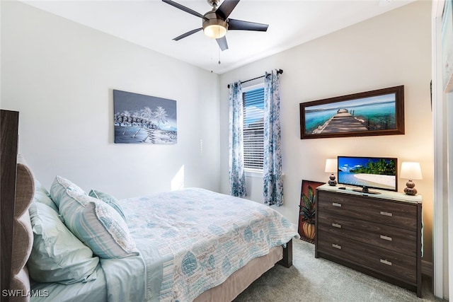 bedroom with ceiling fan and light colored carpet