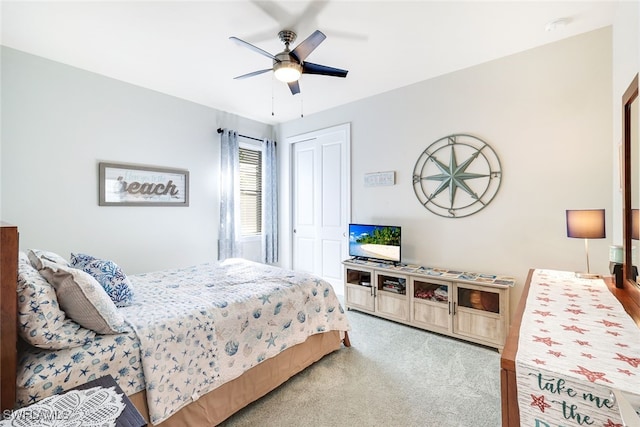 bedroom with carpet flooring, ceiling fan, and a closet