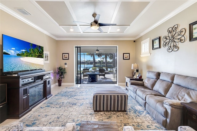 tiled living room with ceiling fan and ornamental molding